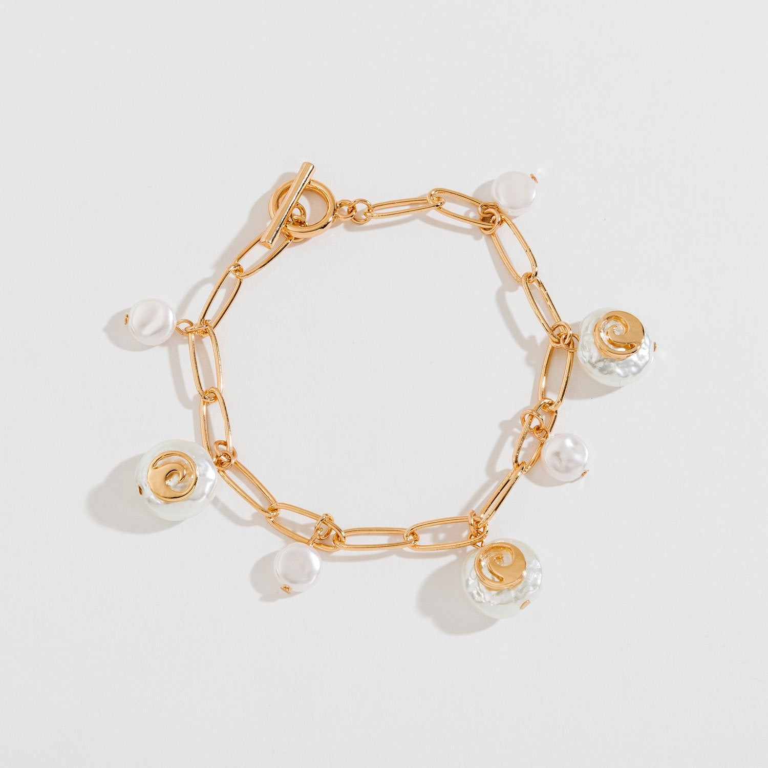 PEARL AND SHELL CHARM BRACELET